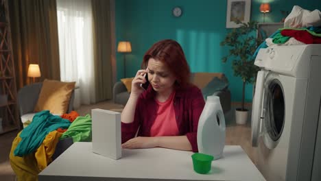 woman on the phone dealing with laundry
