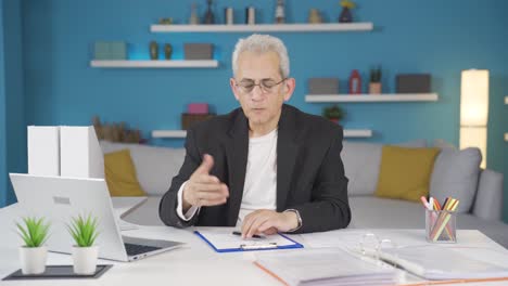 home office worker man reading bad news and feeling frustrated.