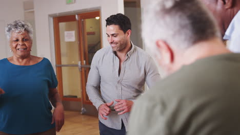 People-Having-Fun-Attending-Dance-Class-In-Community-Center