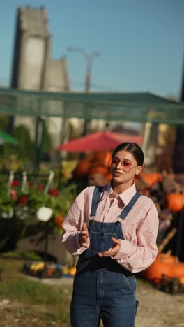 woman at a fall farmers market