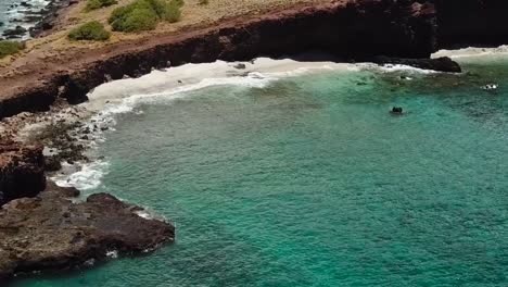 drone aerial cliffside beach hawaii water