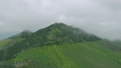 clouds over pico do facho and surrounding landscape
