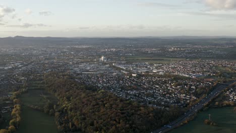 drone aerial shot the german freeway a7 crossing the center of kassel at sunset in germany, hessen, europe