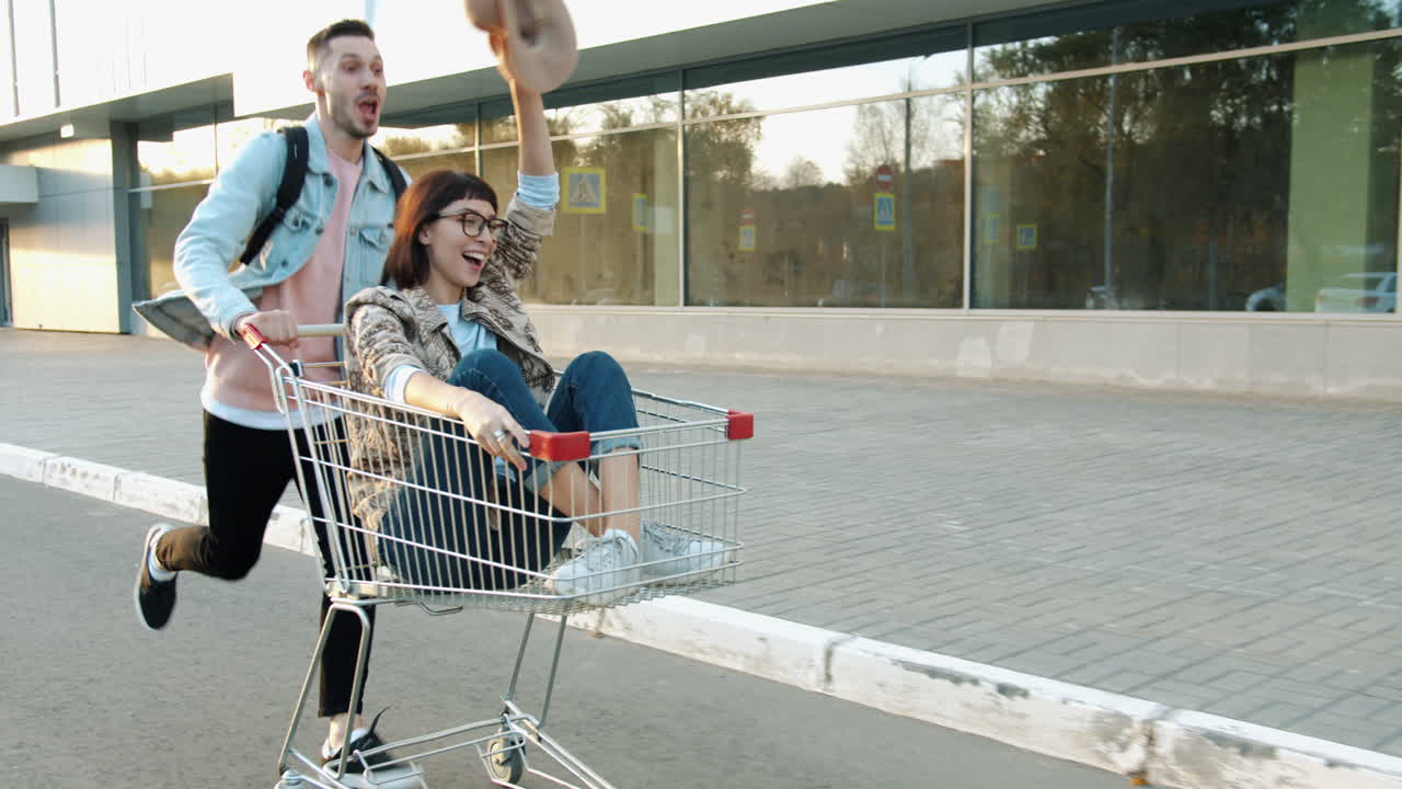 Couple Having Fun with a Shopping Cart