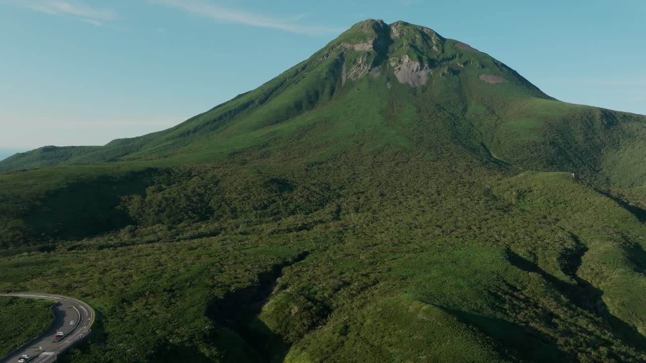 Mount Rausu Covered With Green Forest In Shiretoko Peninsula, Hokkaido, Japan. - aerial shot