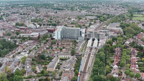 Drone-shot-over-South-Western-British-Rail-train-arriving-at-Twickenham-station