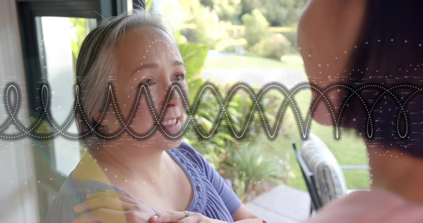 Mature woman speaking in home beside glass door, generating technology waveform showing family bond
