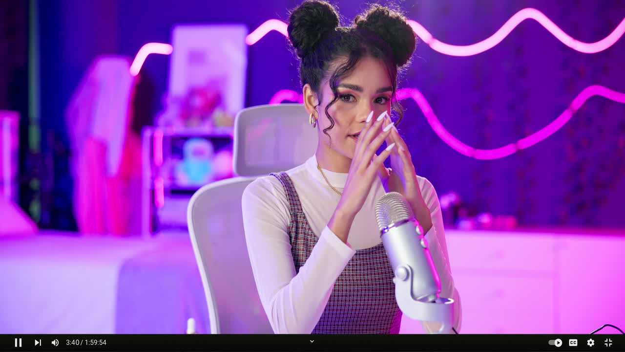 Woman recording ASMR podcast in studio