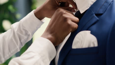 employee puts blazer on mannequin