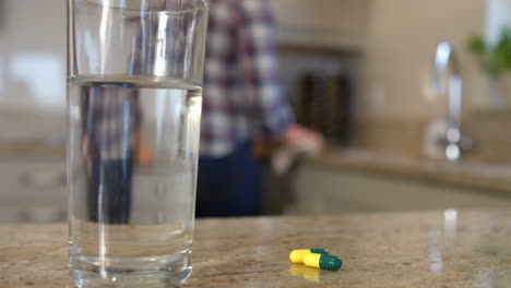 Woman-cleaning-and-taking-pills