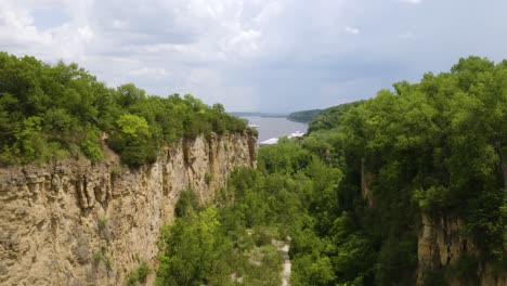 drone flying through horseshoe bluff in mines of spain recreation area, near dubuque, iowa