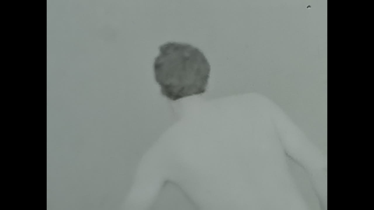 Man Swimming in Body of Water. CIRCA USSR 1980s: A man gracefully swims in the water, enjoying a refreshing and invigorating swim.