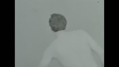 man swimming in body of water. circa ussr 1980s: a man gracefully swims in the water, enjoying a refreshing and invigorating swim.
