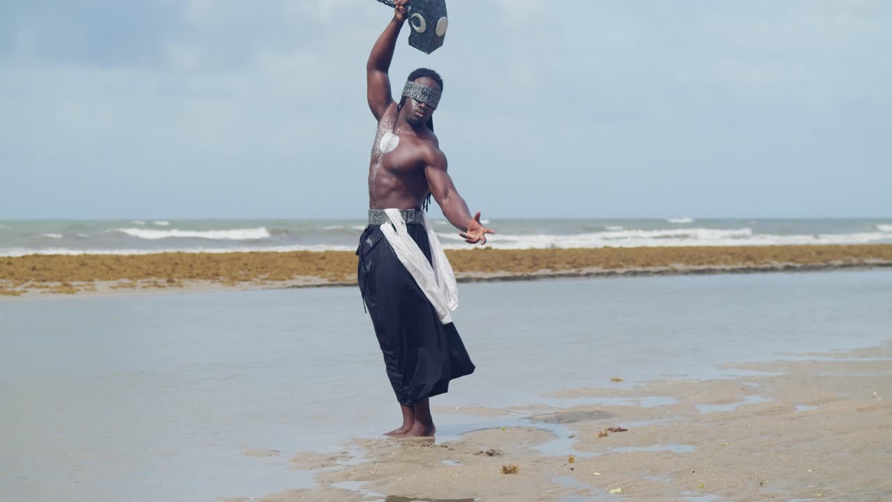 At a tropical beach, a muscular, dark-skinned man is a captivating Nekharis in cosplay