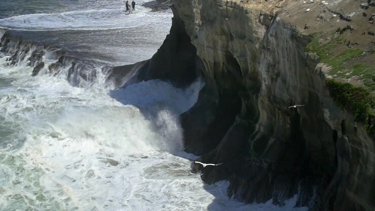 Waves Crashing on Cliff