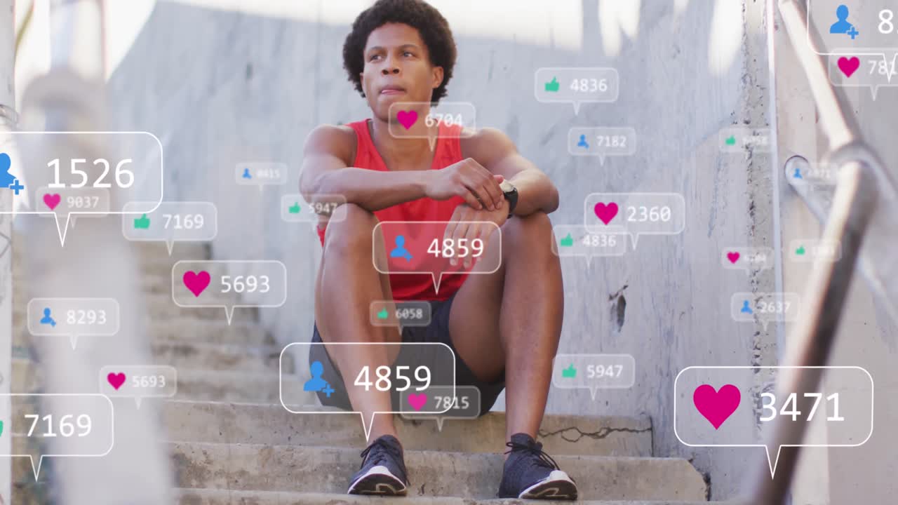 animación de iconos de los medios sobre un hombre afroamericano sentado