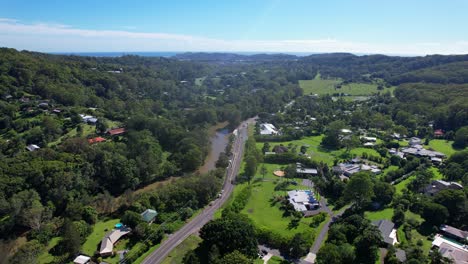 community in scenic landscape, currumbin valley, gold coast, qld, australia - aerial drone shot