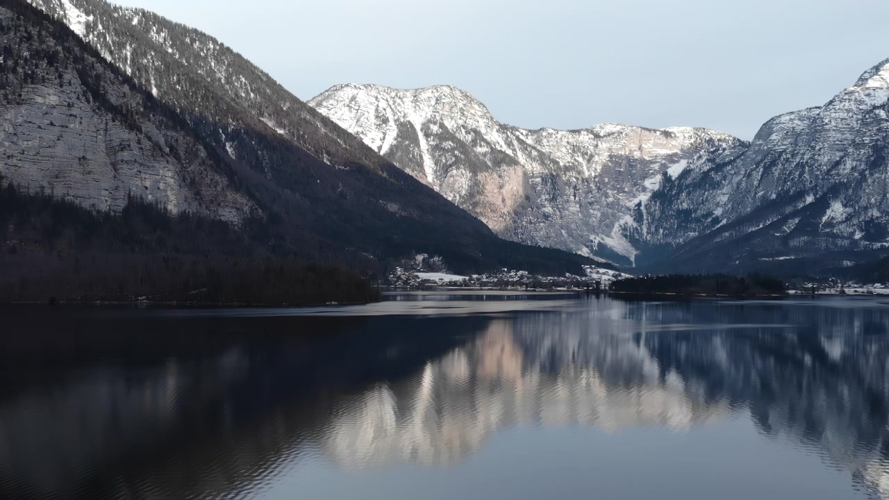 Mirror Calm Lake Reflecting Winter Town And Cliffs, Soft Dawn Light, Imagined Early Commuter Walking Pier,