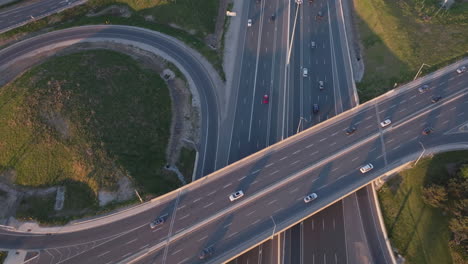 mississauga highway 401 with vehicles moving along the overpass in slow motion, aerial view