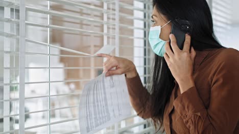 video of woman boss with phone looking at empty office