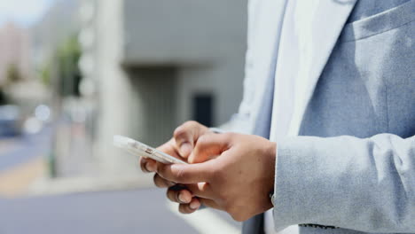 hands, phone and businessman in city texting