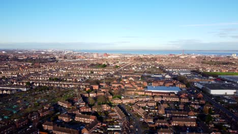 wide angle drone shot panning right across grimsby skyline in england