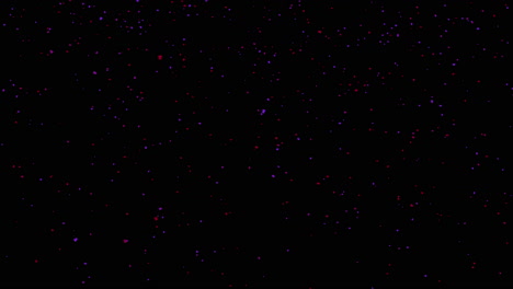 volar pequeñas partículas rojas y azules sobre fondo oscuro