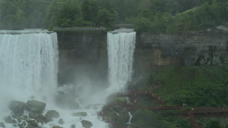 pan across the bridal falls and the american falls with seagulls through the frame