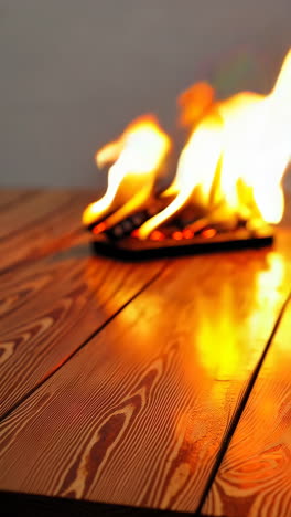 burning wood on wooden table