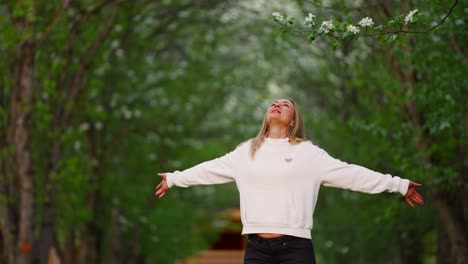 woman enjoying spring in a forest
