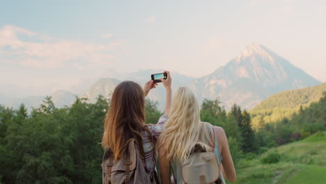 two women taking photos. best friends taking