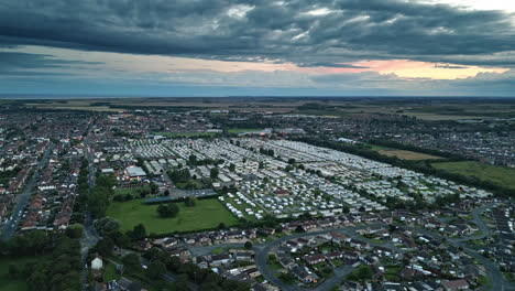 Aerial-visuals:-Skegness-seaside-town-seen-from-drone-during-summer-sunset