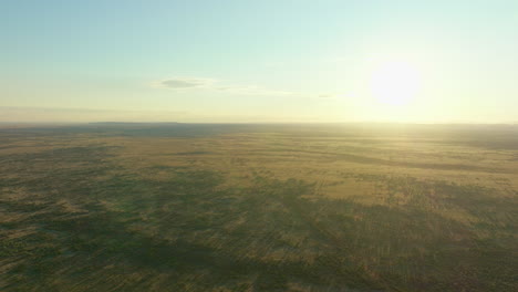 High-Aerial-Drone-Flyover-Alice-Springs-Simpson-Desert-Arid-Australian-Outback-Landscape-With-Sun-On-Horizon-4K