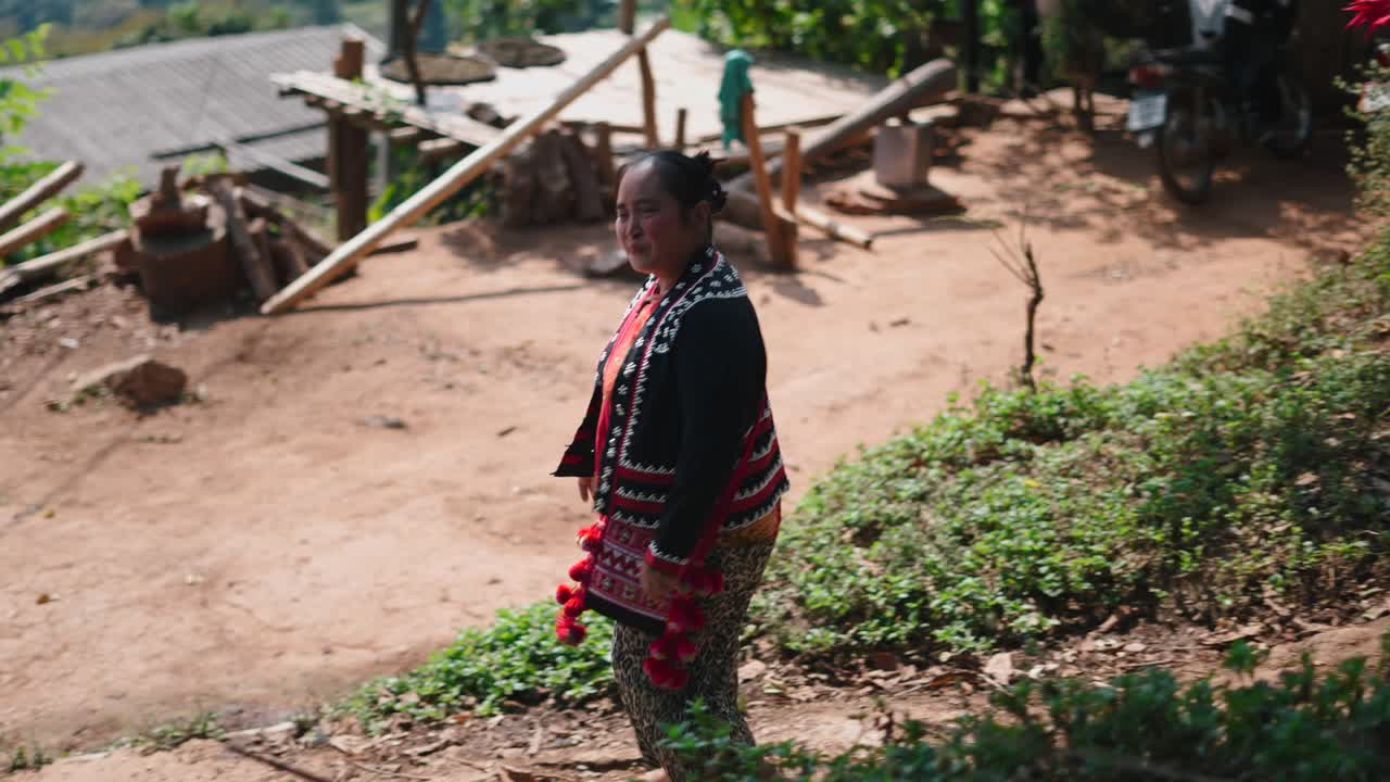 Woman in traditional hill tribe clothing in a rural village