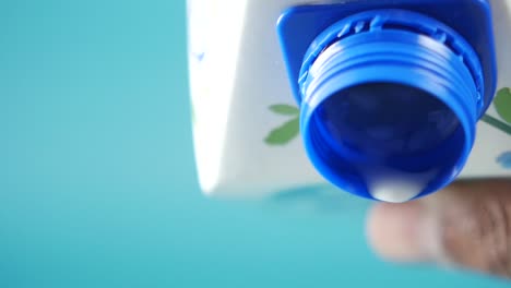 pouring milk from a carton