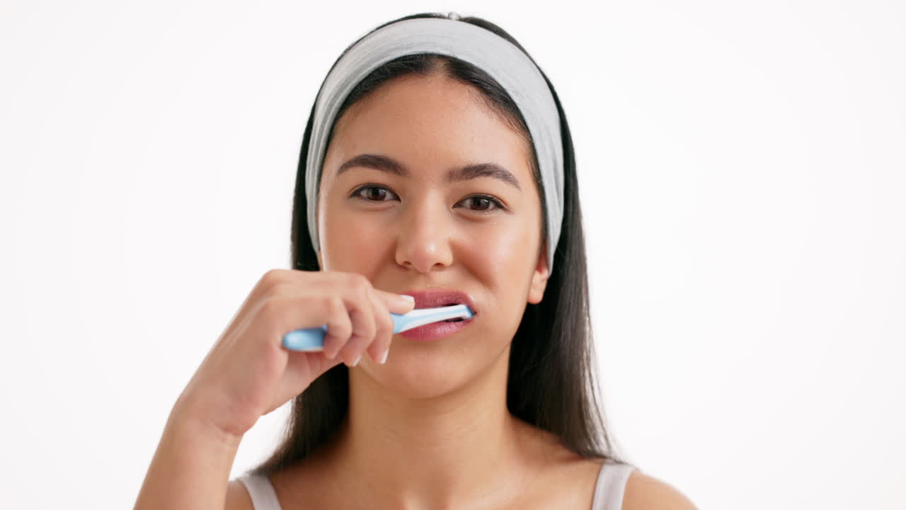 Woman Brushing Her Teeth