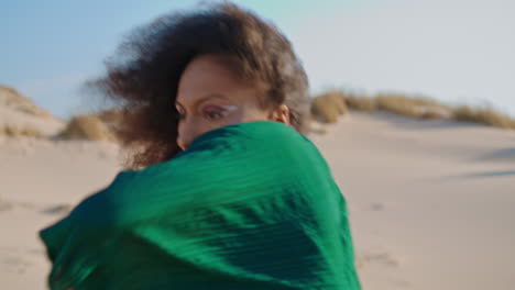 Inspired-girl-dancing-sand-desert-close-up.-African-woman-dancer-moving-smoothly