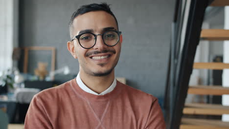 smiling man in glasses in office