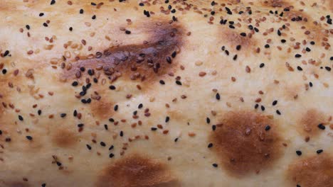 close-up of a baked bread with seeds