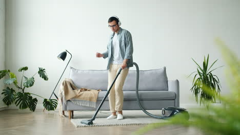 man dancing while vacuuming