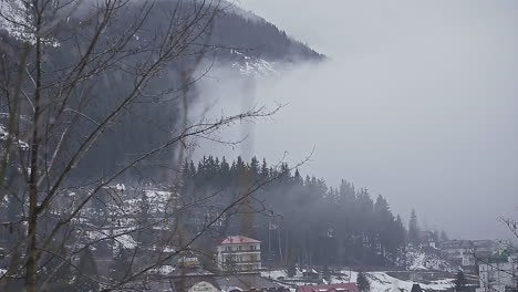 Foggy-cloud-advancing-over-a-frozen-city