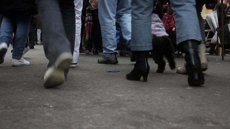 Low Angle View of People Walking on a Busy City Street