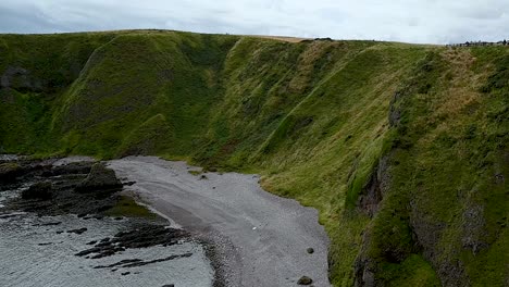 Relaxing-near-the-beach-close-to-Dunnottar-Castle,-Scotland,-United-Kingdom