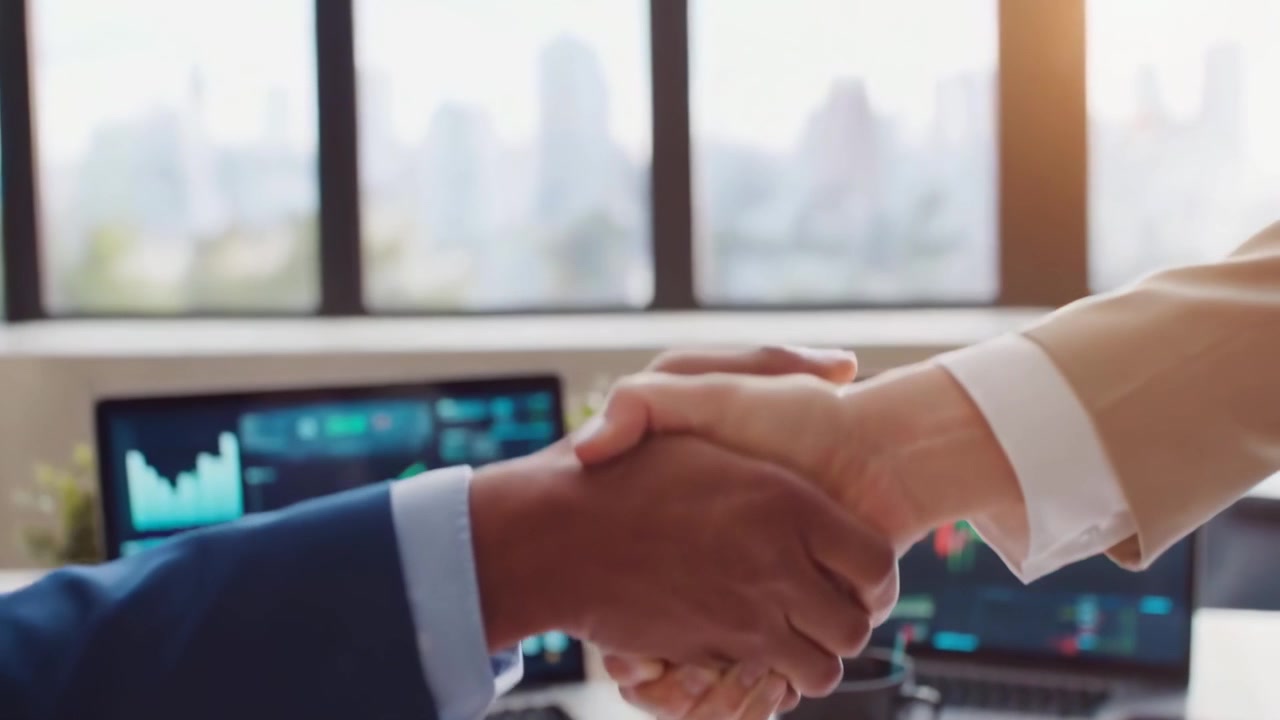 Business Partners Shaking Hands in Modern Office