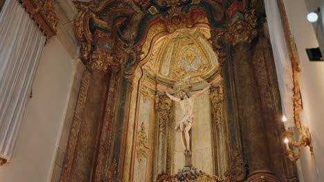 christ on cross displayed within golden baroque altar interior