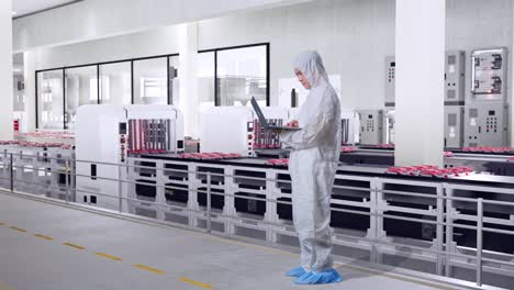 meat processing plant worker using laptop