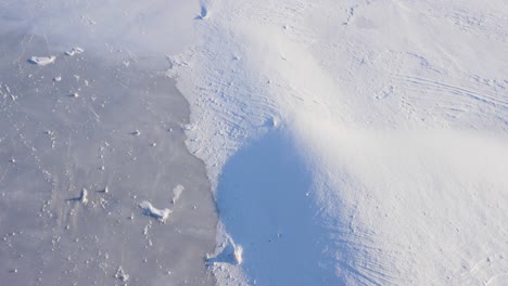 beautiful winter landscape, icy river covered with windy snow, winter cold, winter background.