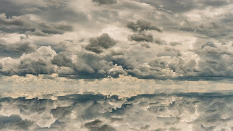 futuristic background consisting of time lapse clip of white fluffy clouds over blue sky and their reflection, video loop