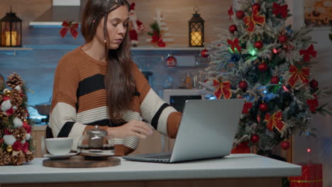 festive adult having to do work project on laptop