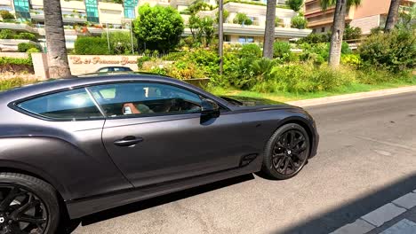 a black luxury car driving through monte carlo